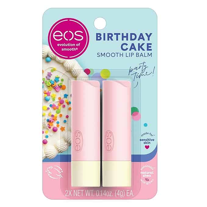 Image of eos Birthday Cake Smooth Lip Balm packaging. It showcases two pink lip balm tubes with yellow bases. The card features a cake with colorful sprinkles, text reading "party time!", and highlights it's made for sensitive skin with natural shea. Perfect for Thursday deals!.