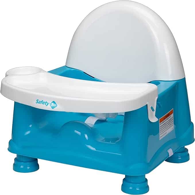 Discover the perfect addition to your child's mealtime setup with our blue and white booster seat. Featuring a removable tray, safety straps, and suction cup-like feet for stability, it's available now as part of our exclusive Monday Deals. The "Safety 1st" logo ensures trusted quality.