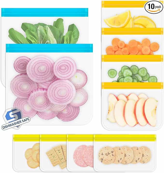 Various reusable bags containing vegetables, fruits, cookies, and crackers are displayed with colored seals in blue, yellow, or orange. A dishwasher-safe symbol is visible. Perfect for Monday Deals, they include lettuce, onion slices, lemon, carrots, cucumber, apples, and snacks.