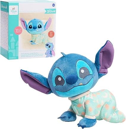 A plush toy of Stitch from Disney, donning mint green pajamas with orange patches, is perfectly posed next to its packaging showcasing Disney branding. Snag this adorable character during our Wednesday Deals for a touch of charm at a delightful price!.