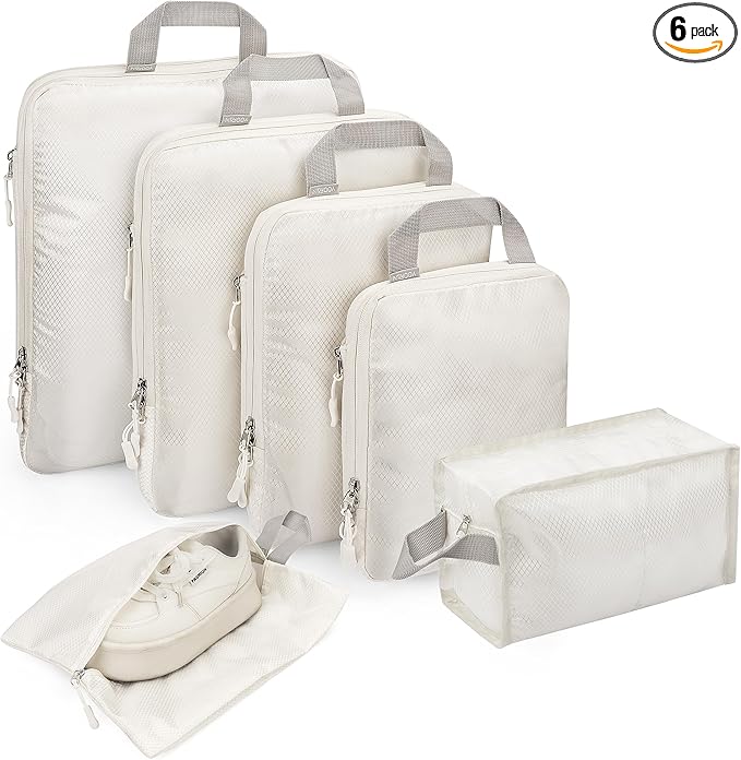 Discover our set of six white packing cubes, including various sizes with zippers and handles. Perfect for travel, one cube is shown holding a pair of shoes. Grab this fantastic offer as part of our exclusive Tuesday Deals.