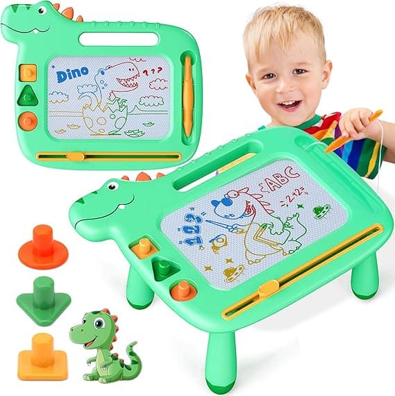 A child joyfully explores a dinosaur-shaped magnetic drawing board, part of the irresistible Wednesday Deals. The board showcases vibrant dinosaur and alphabet designs. Geometric pegs and a small dinosaur figure add to the fun as the child smiles, stylus in hand.