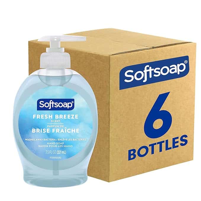 A cardboard box labeled "Softsoap 6 Bottles" stands beside a Fresh Breeze scent Softsoap hand pump, offering 7.5 fl oz (221 mL) of cleanliness. Don't miss out on Friday Deals for a refreshing touch at every sink.