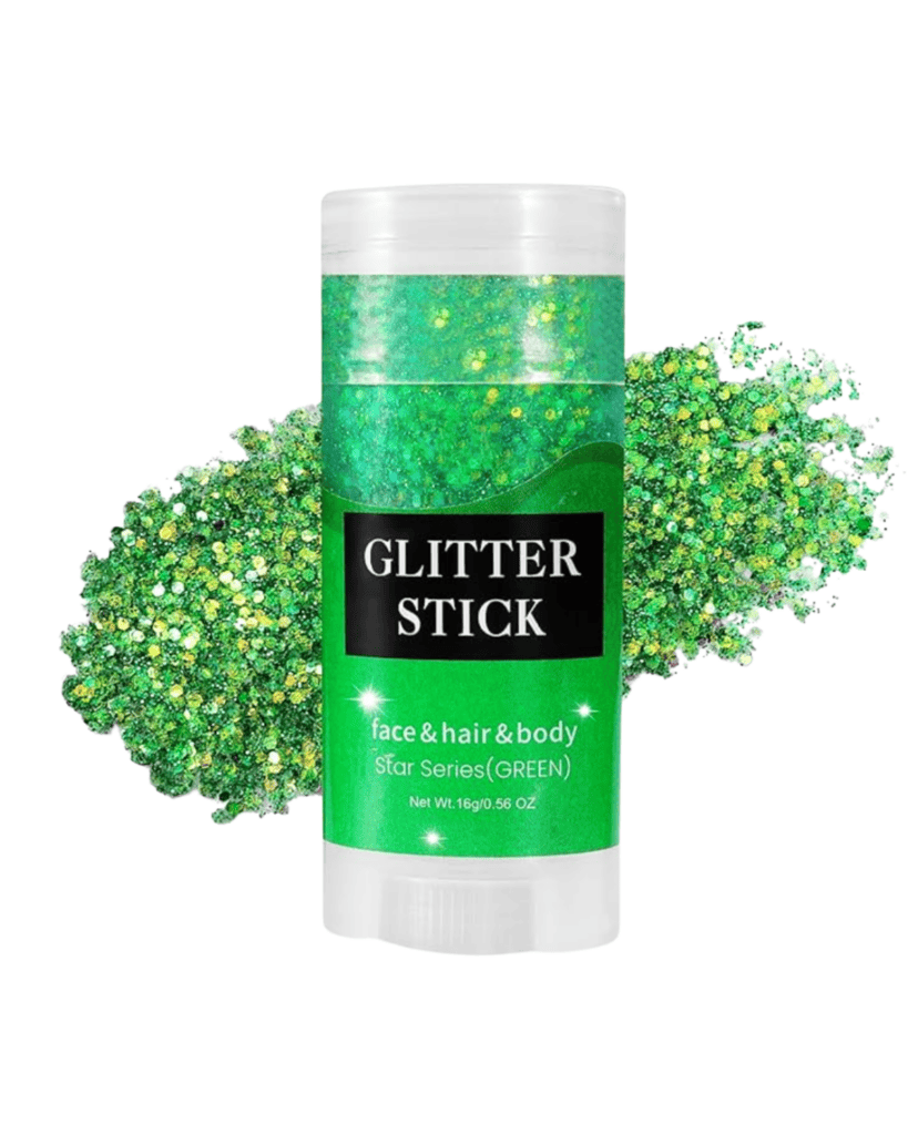 A glitter stick with a green label, perfect for St. Patrick's Day accessories, labeled for face, hair, and body use as "Star Series (GREEN)." It sits amid a spread of vibrant green glitter. Packaging declares the net weight as 16g or 0.56 oz.